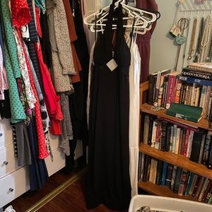 Long floor length black prom dress with rhinestone detail diamond, sheer back.
